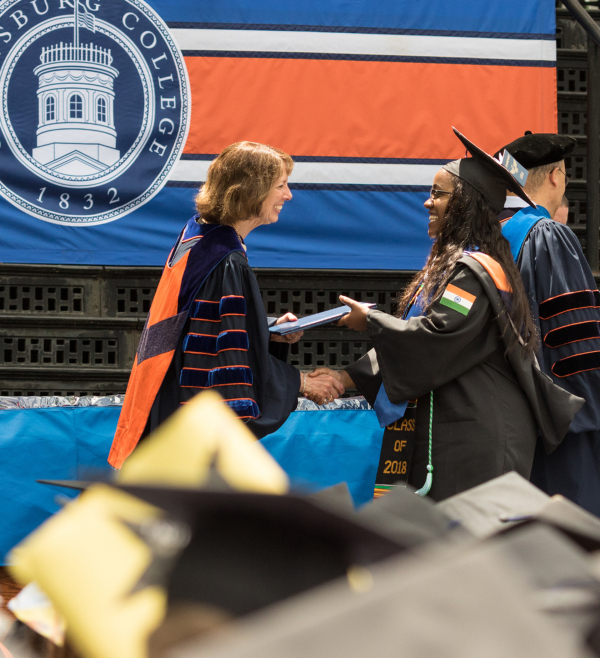 Chentese Stewart-Garner crossing the stage at Commencement.